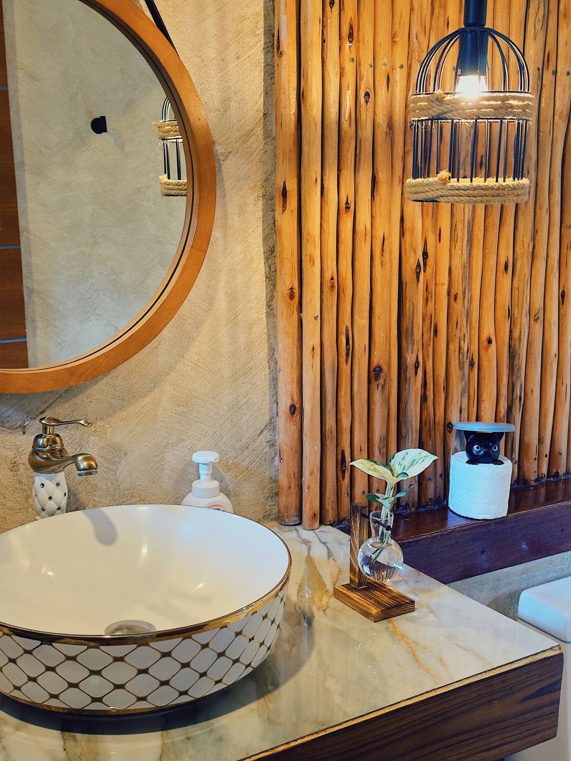 Bungalow A: patterned basin and natural wood bathroom details