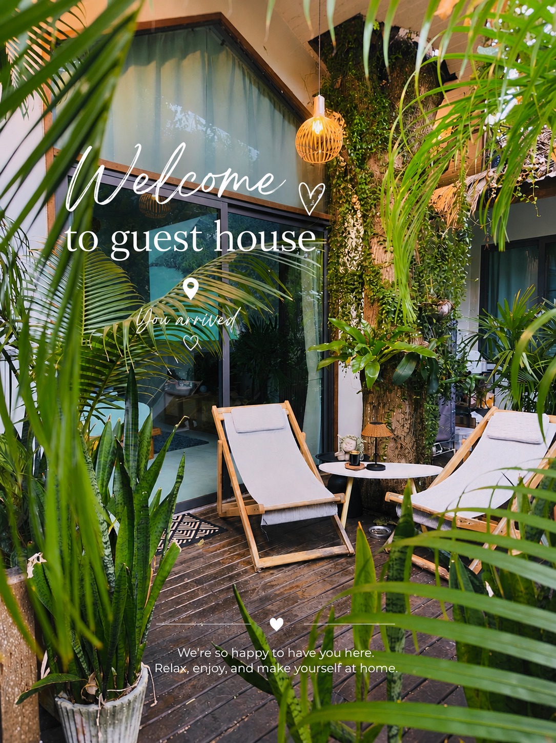 Salad Beach Guest House: two deckchairs on a wooden terrace surrounded by tropical plants
