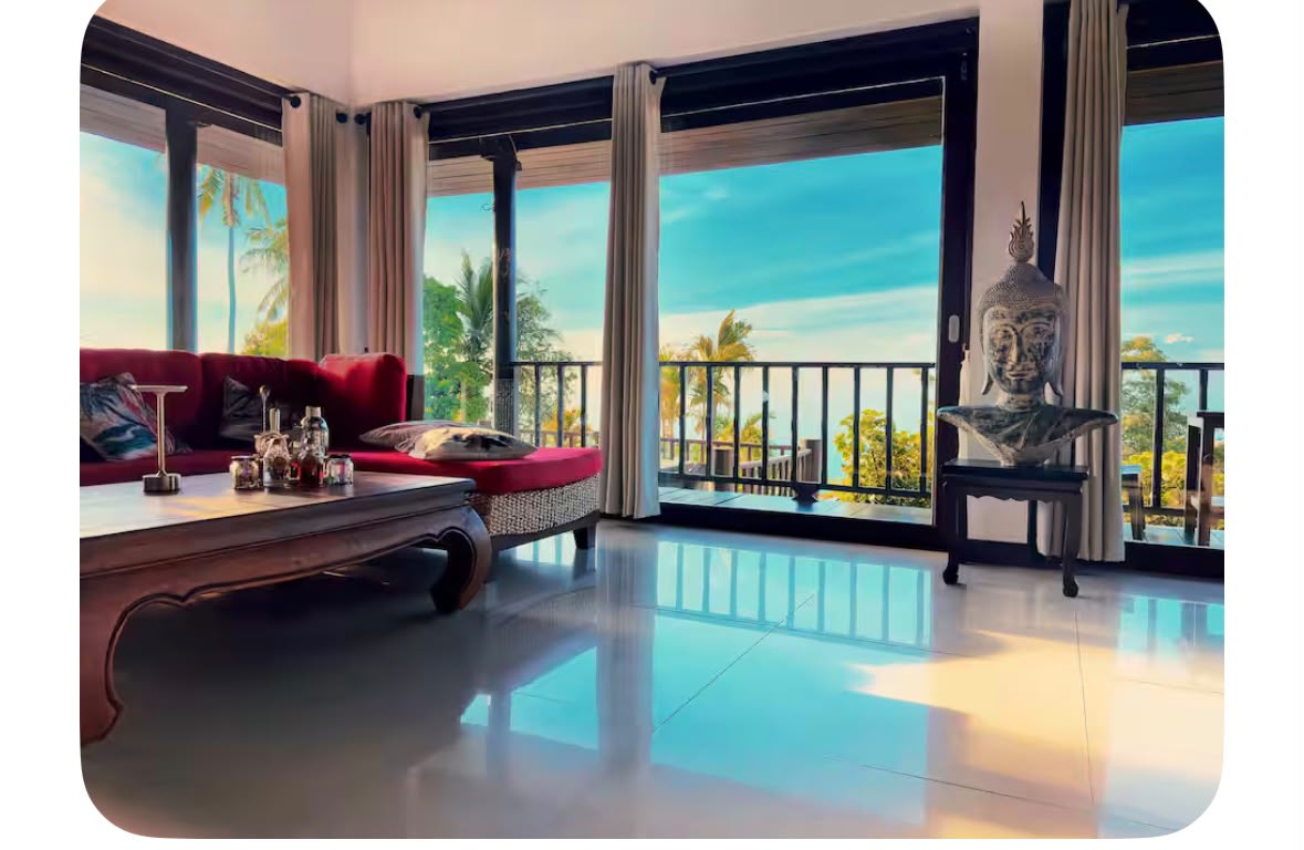 Sea View Villa Tropicana: living room with a red sofa and tall windows overlooking the sea